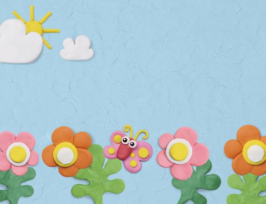 Flower garden textured background in blue plasticine clay craft for kids